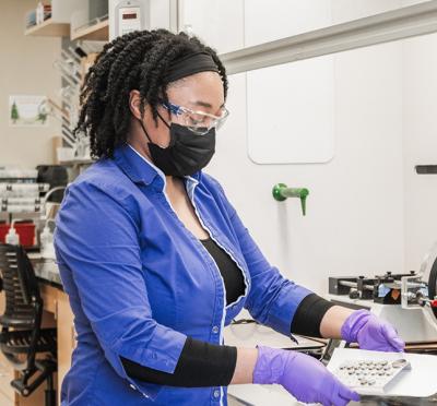 Kenya Hazell working in the lab to develop polymer composites.