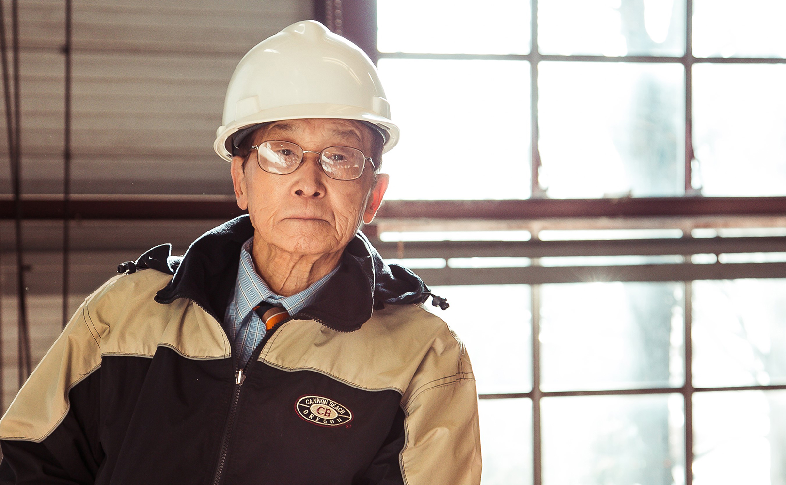 Jai Kim wearing construction uniform.