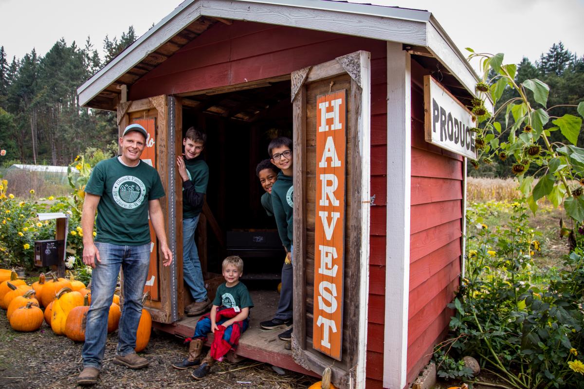  David Blunck and his family pose in a shed on their farm.