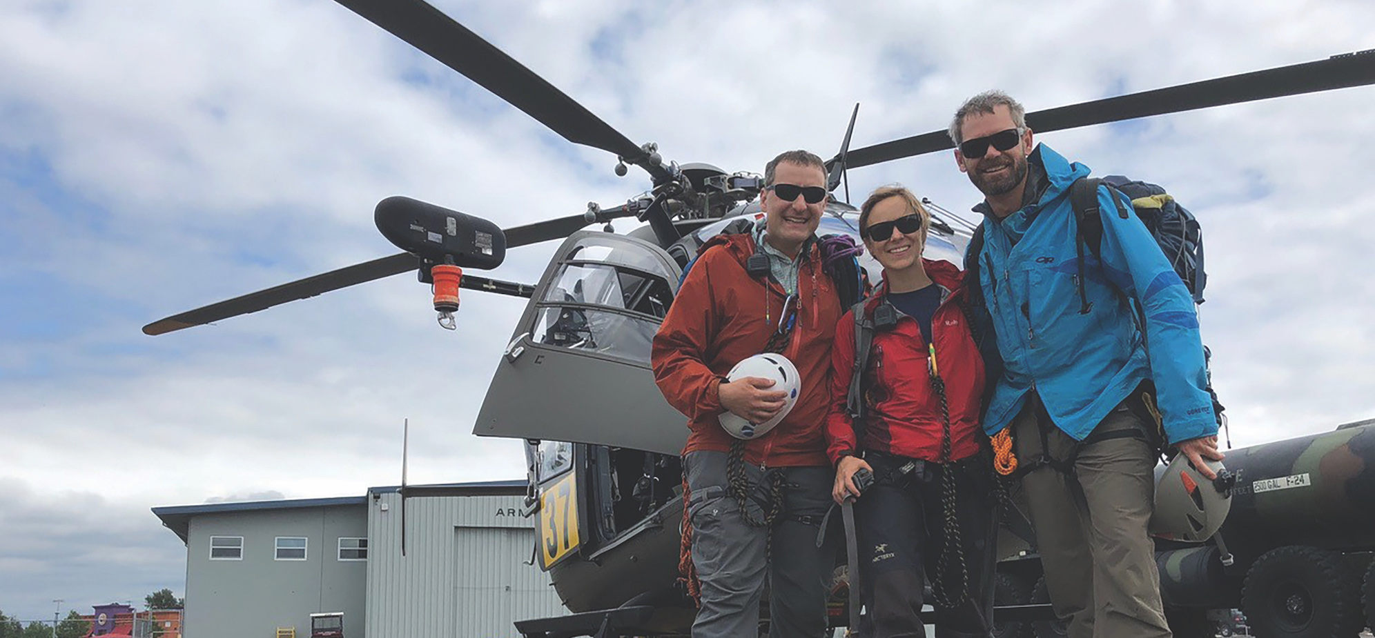 odd Shechter, Anna Pakenham Stevenson, and John Stevenson in front of an Oregon Army National Guard UH-72A Lakota Helicopter.