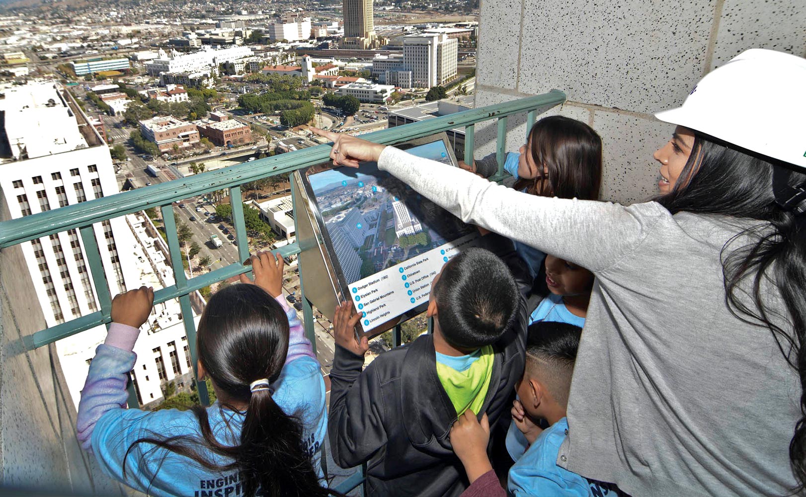 Monica Morales teaching young students about civil engineering during a field drip.