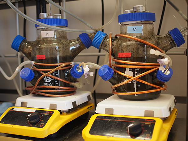 Two machines with wires and elastic bands.