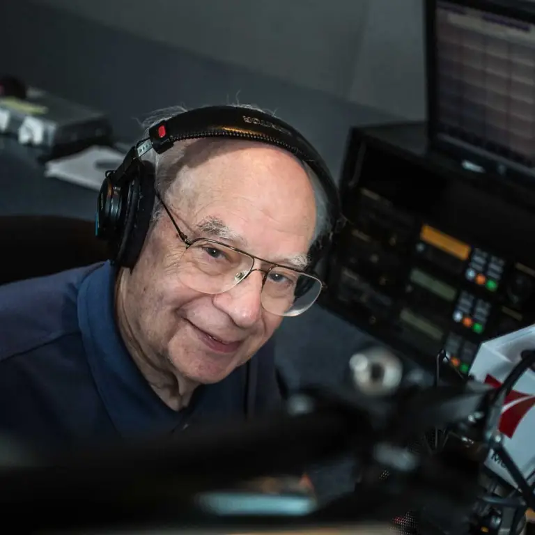 John Lienhard wearing studio headphones.