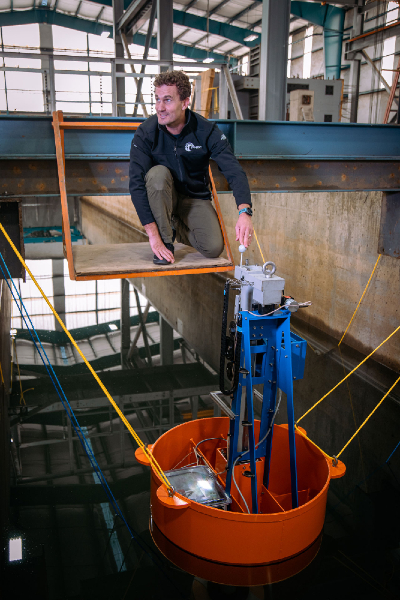 Bryson Robertson working on a LUPA prototype suspended in water.