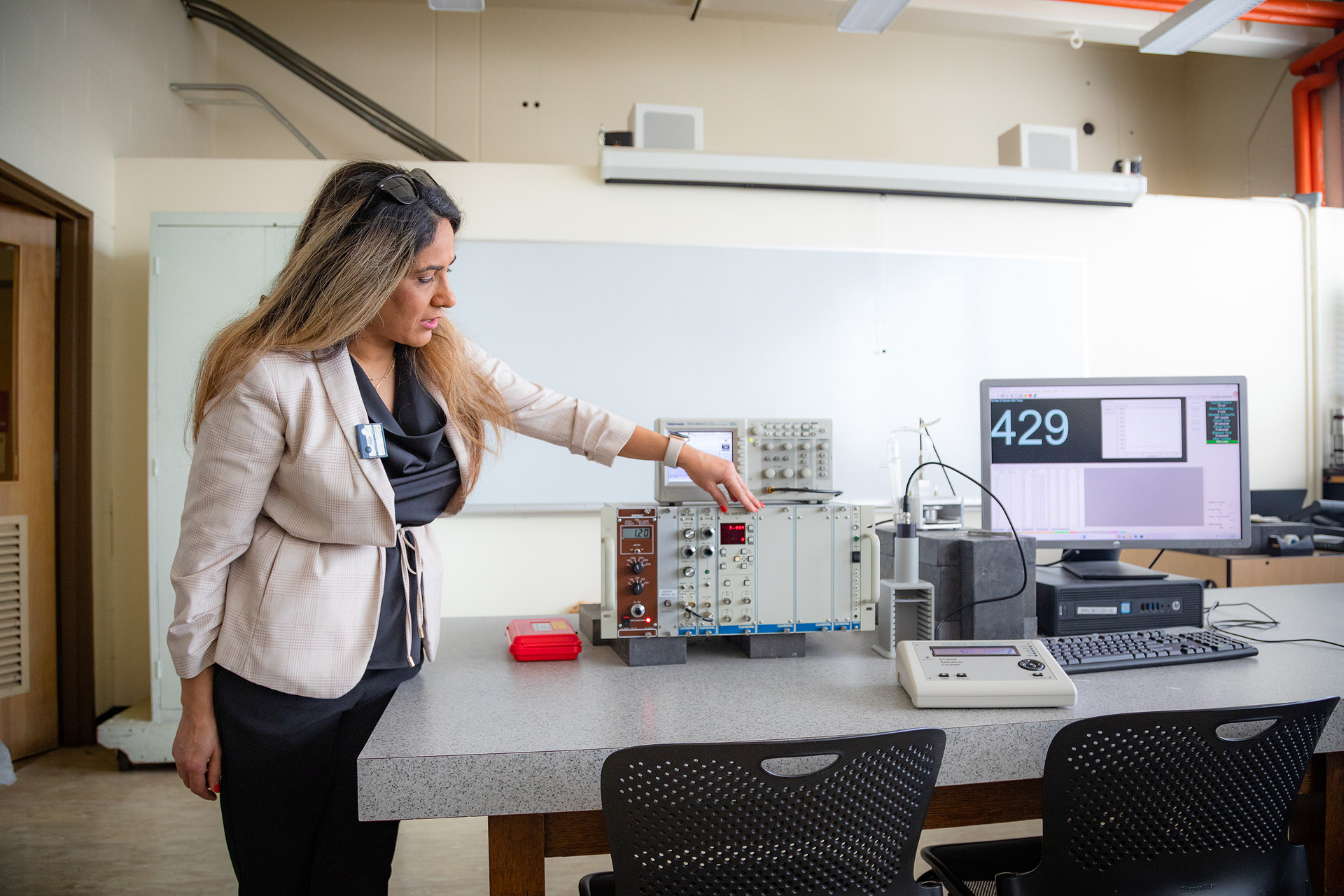 faculty member working in a lab.