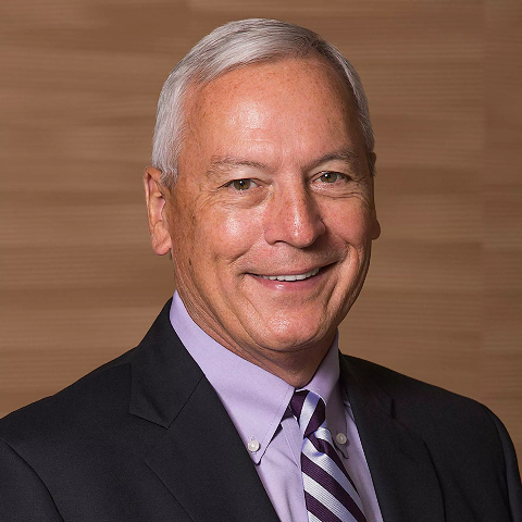 A portrait with subject, Jay Culbertson, in suit facing the camera