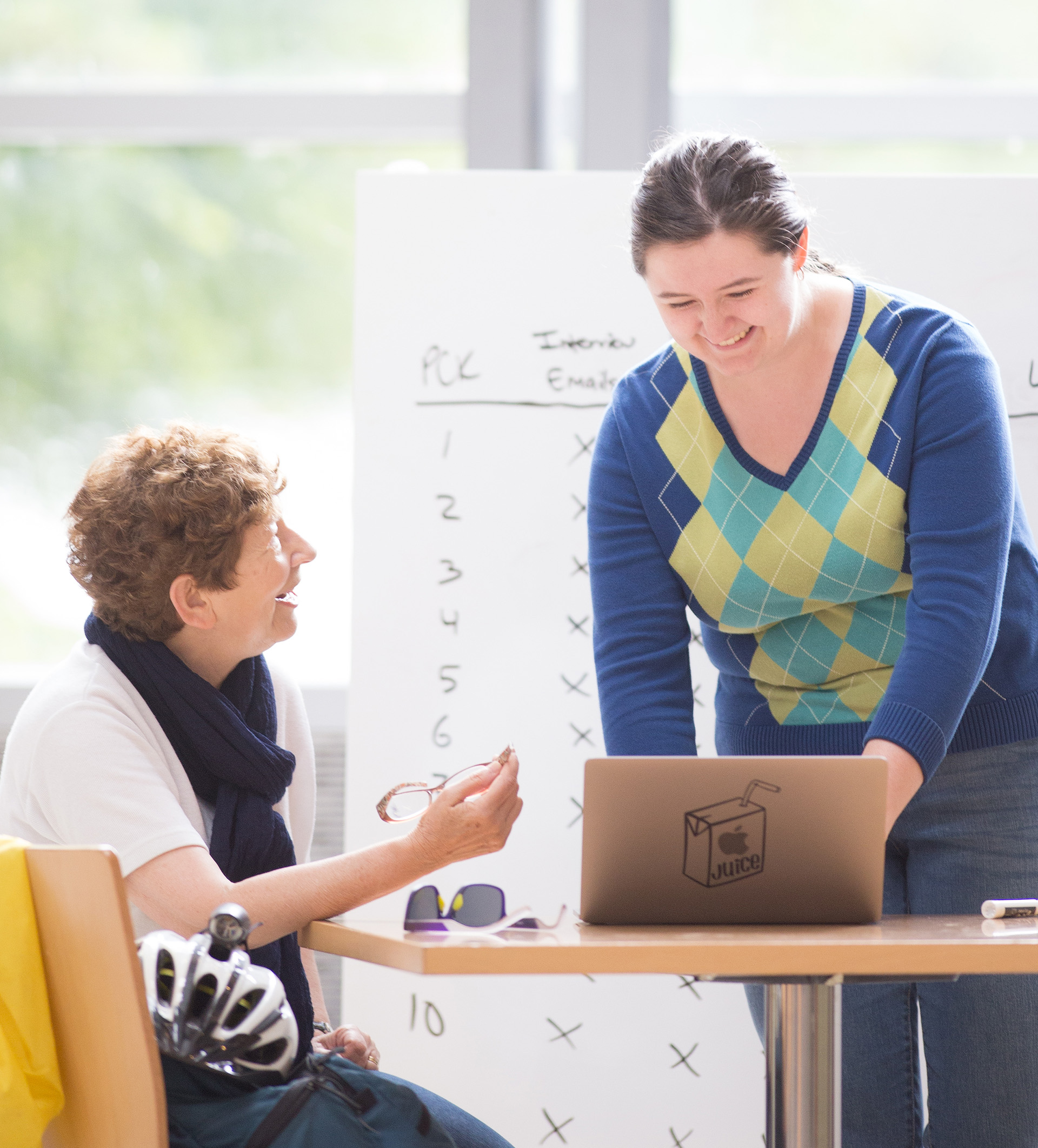 Margaret Burnett, professor of computer science, having a discussion with a student.