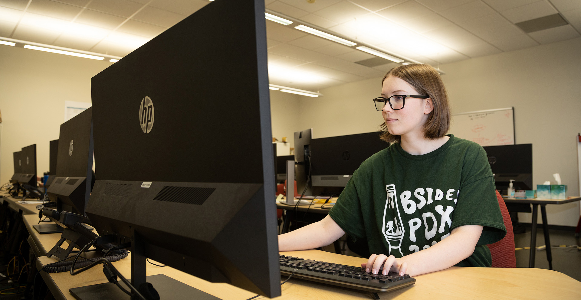 A student using a computer in the classroom.