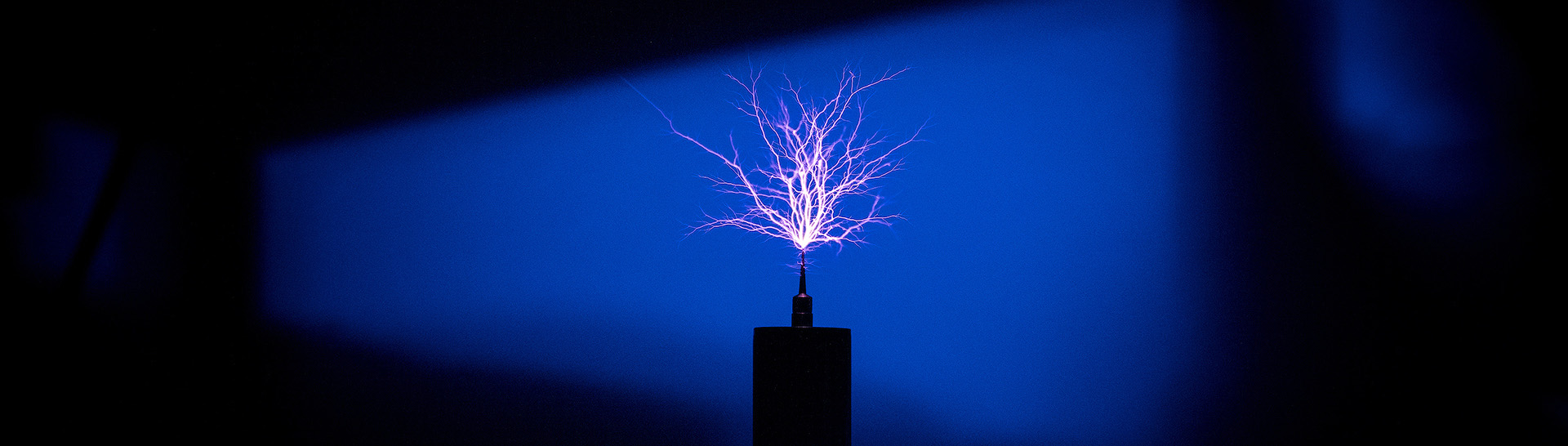 A blue background with electric flares.