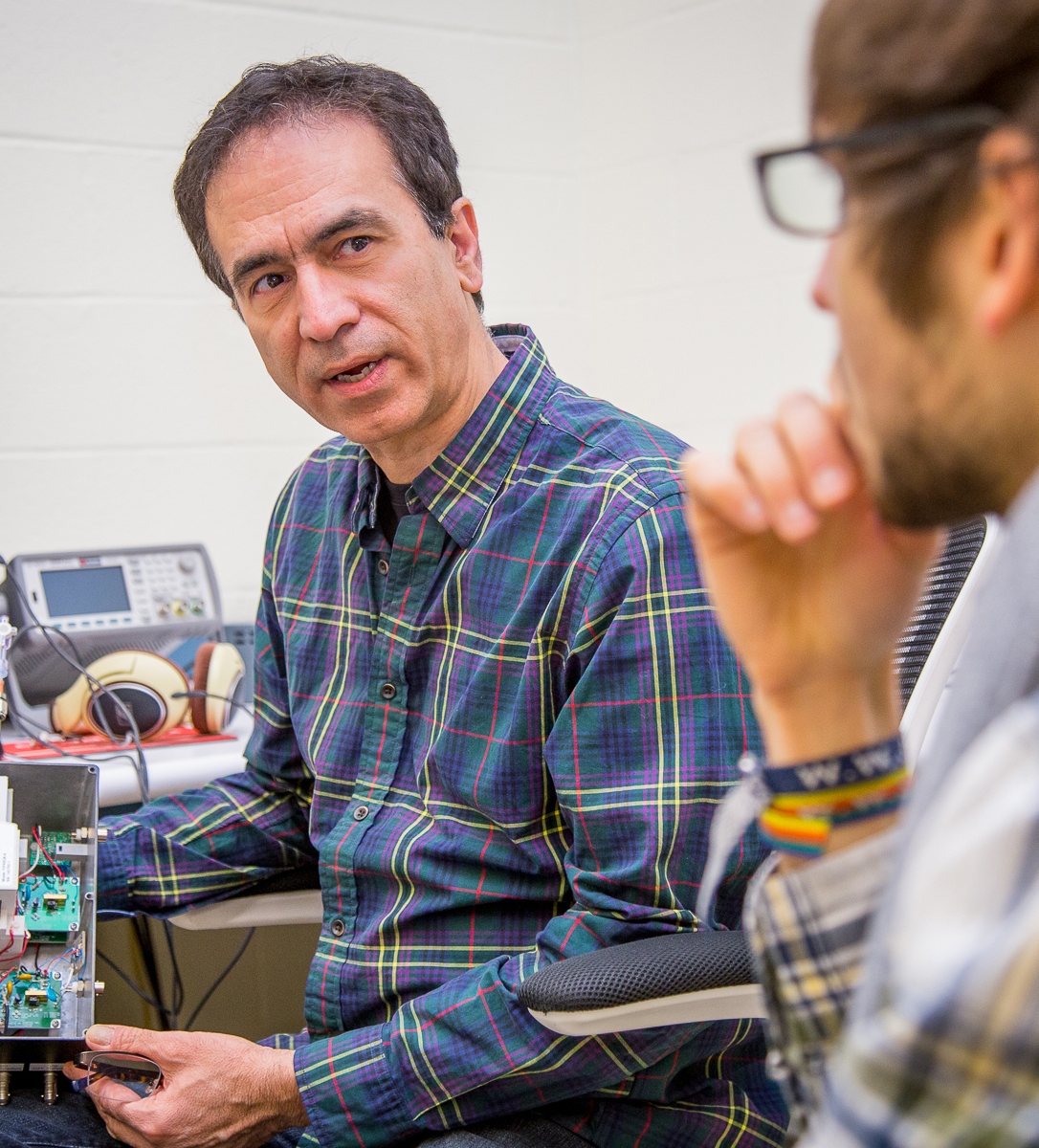 Abi Farsoni, profedssor of Radiation Health Physics, having a discussion with a student.