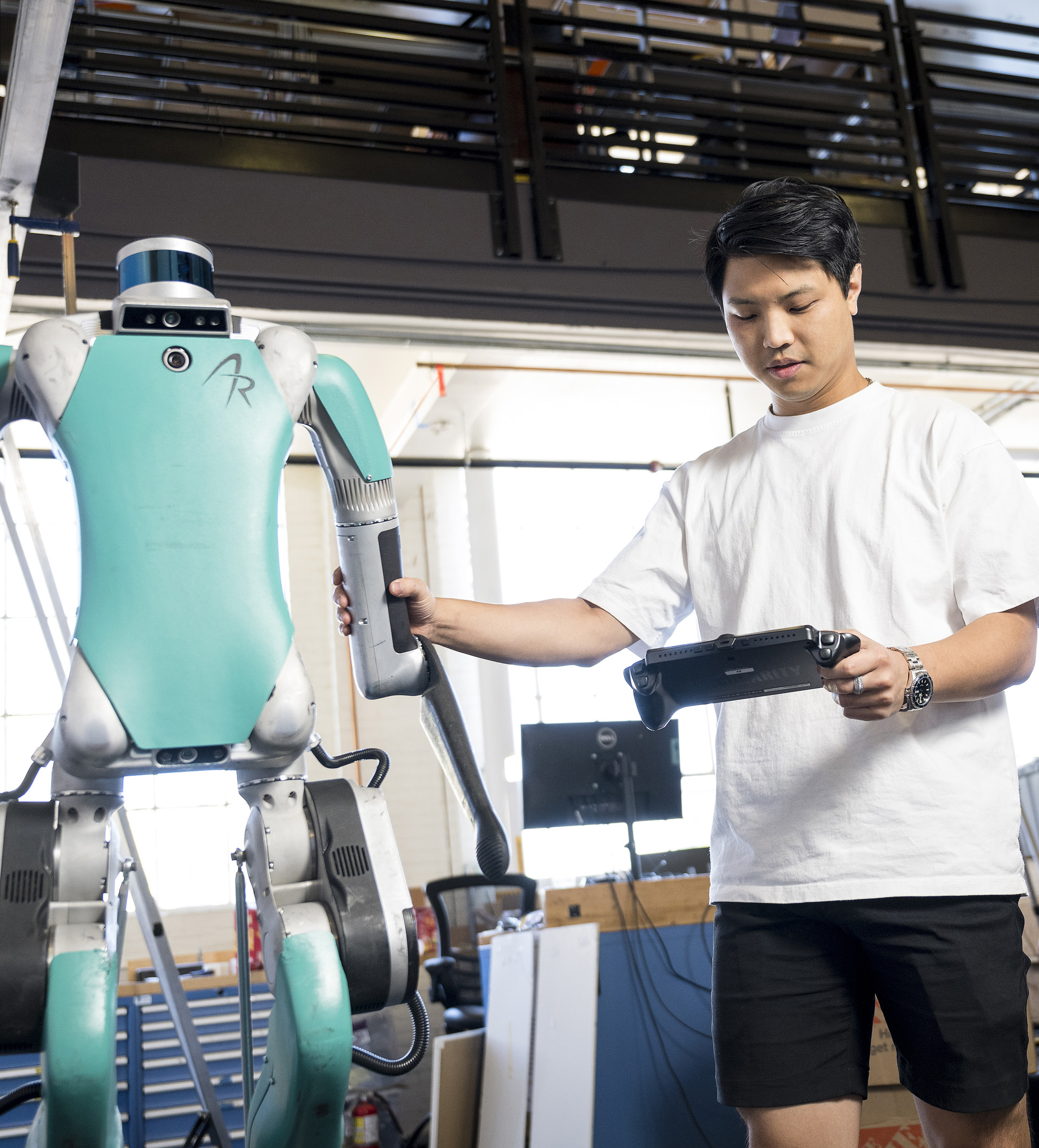 Robotics engineering student testing a robot.