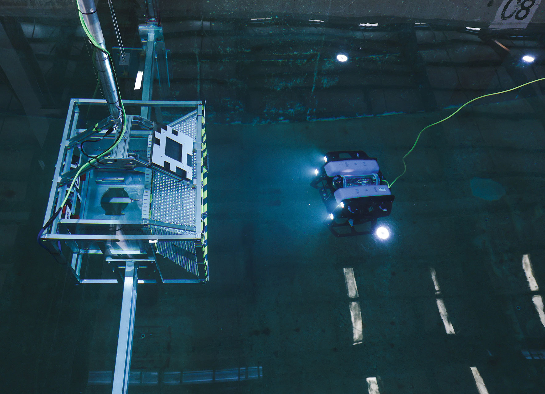 Robot navigating an underwater testing facility.