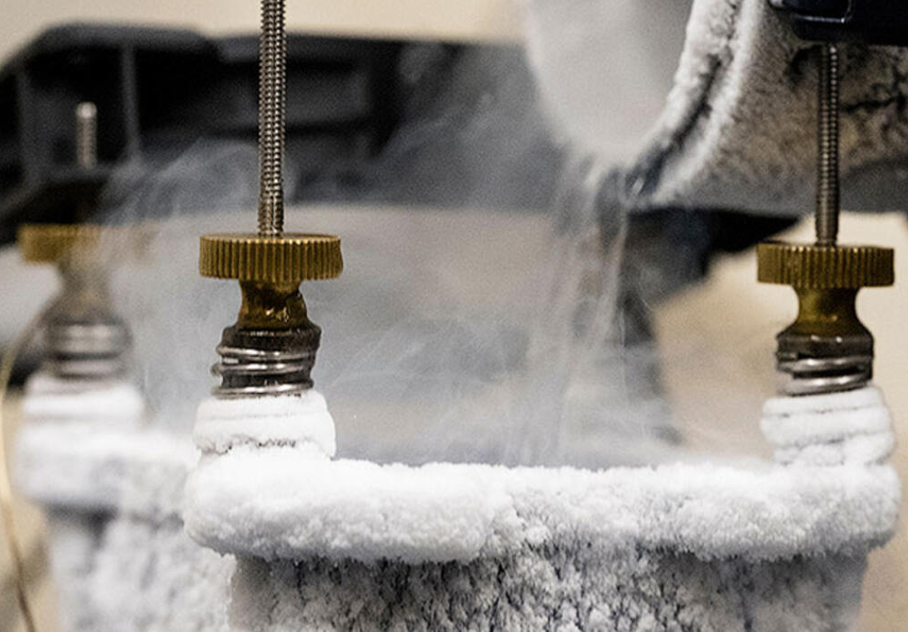 Liquid nitrogen being poured into a container.
