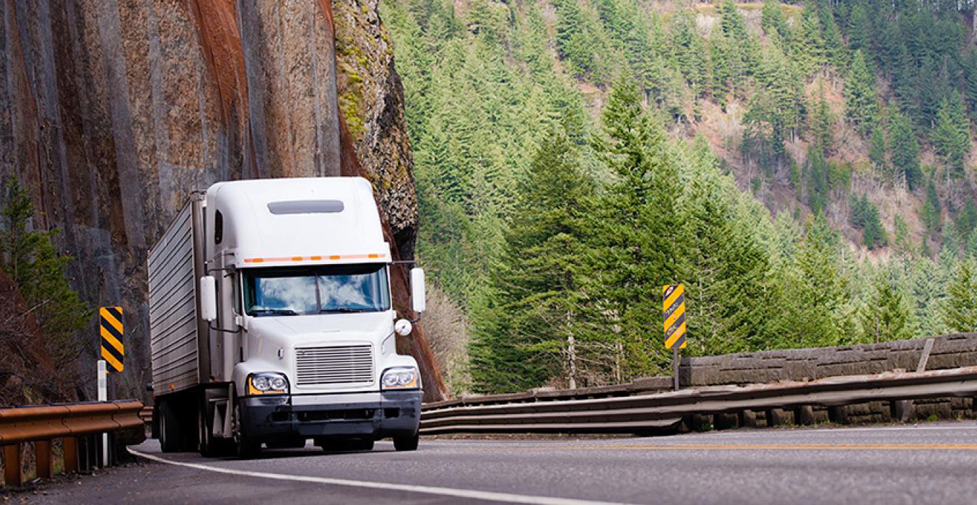 A truck on a narrow road.
