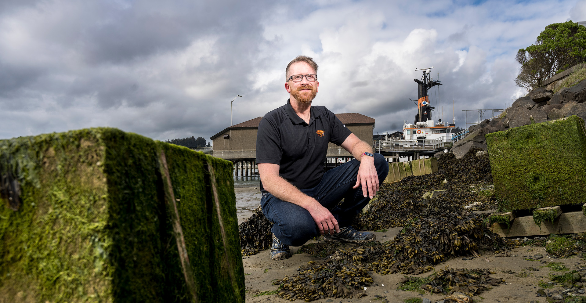 A portrait of a man by the shore.