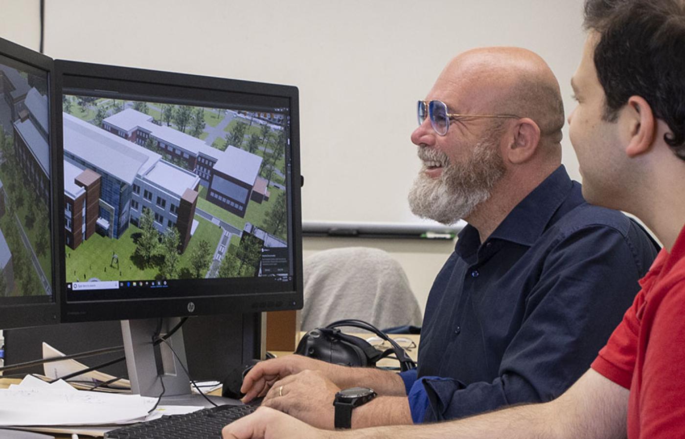 Raffaele de Amicis in his lab with graduate student Arash Shahbaz Badr.