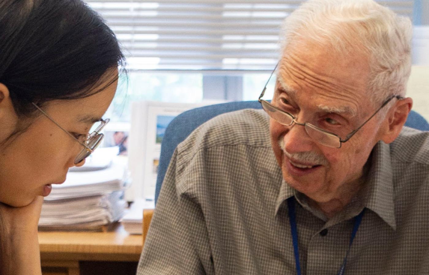 Gabor Temes reviewing some papers with graduate student Yanchao Wang.