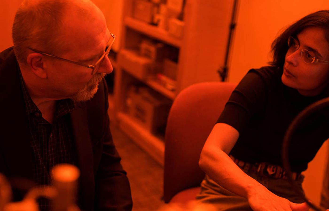 Two people talking.