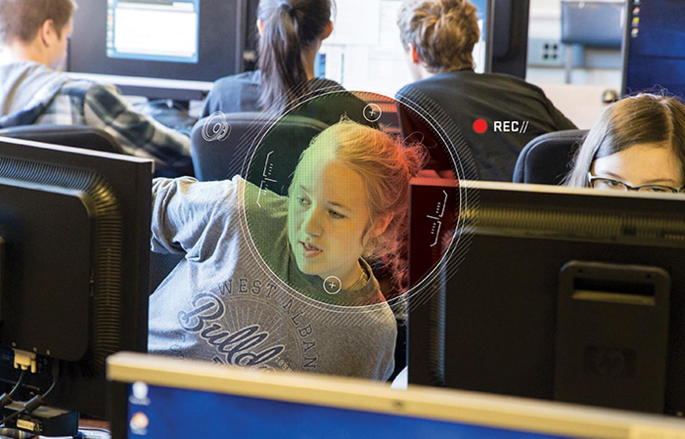 A student in front of a computer.