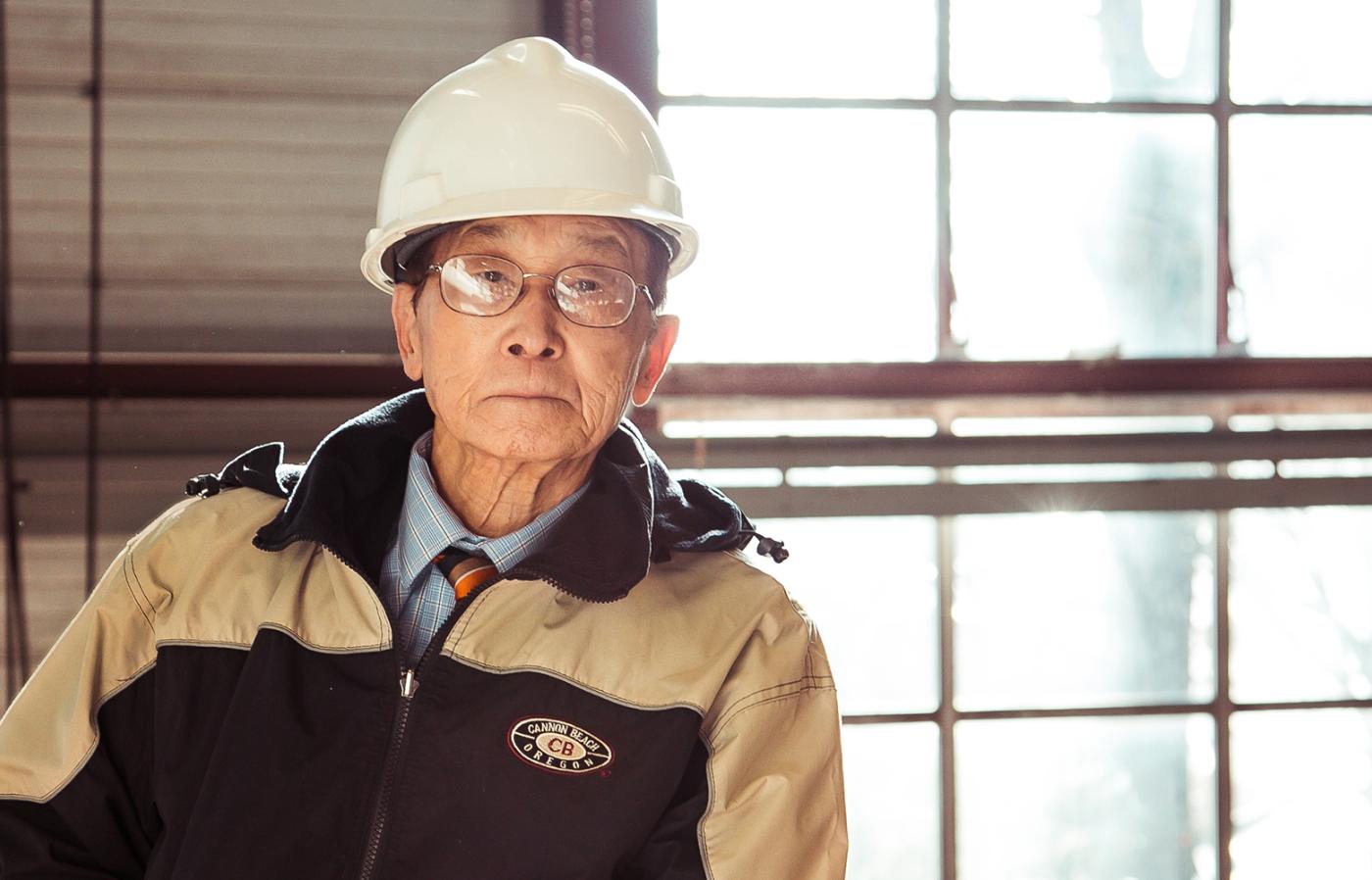 Jai Kim wearing construction uniform.