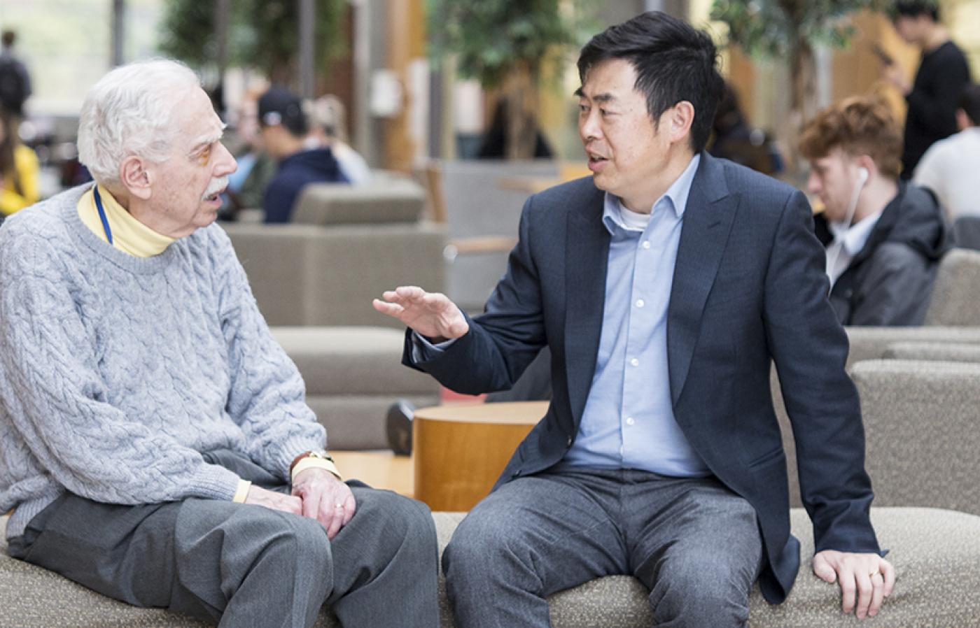 Two people talking sitting at Kelley engineering center.