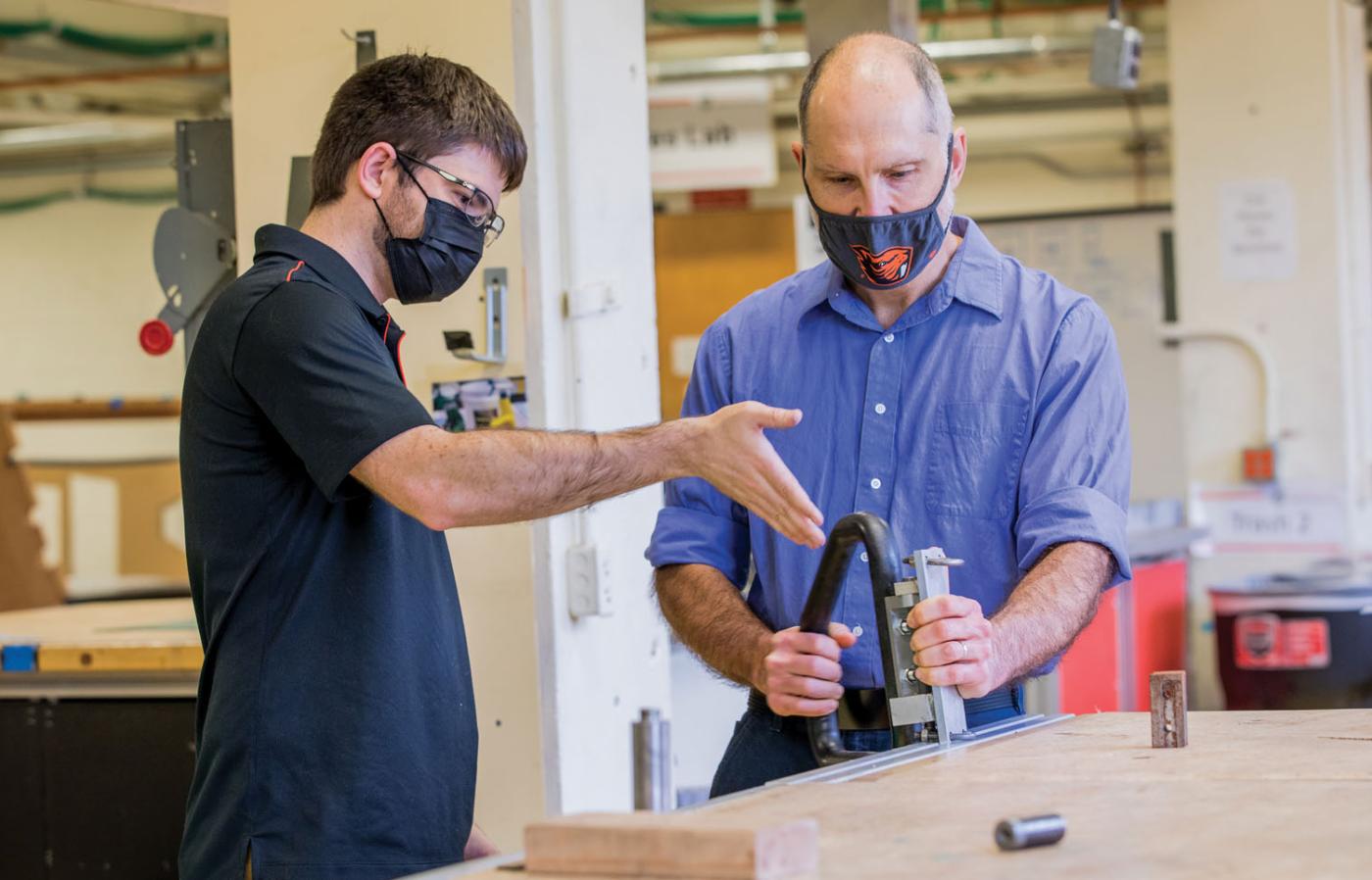 two faculty members working together