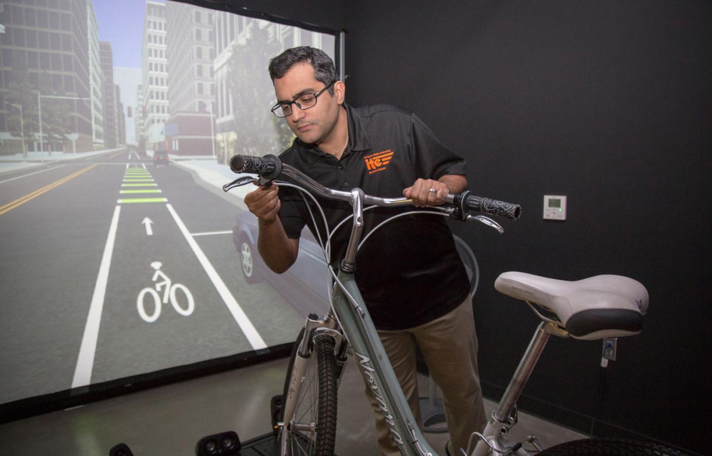 Masoud Ghodrat working on a virtual reality bike project.