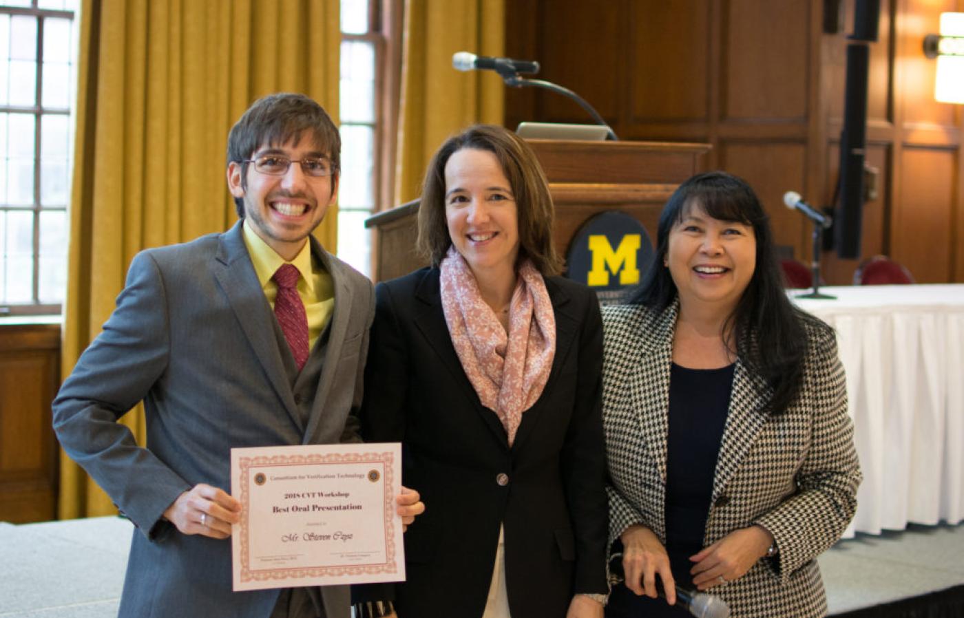Steven Czyz (left) accepts his best talk certificate from CVT Director Sara Pozzi (center) at the CVT Workshop.