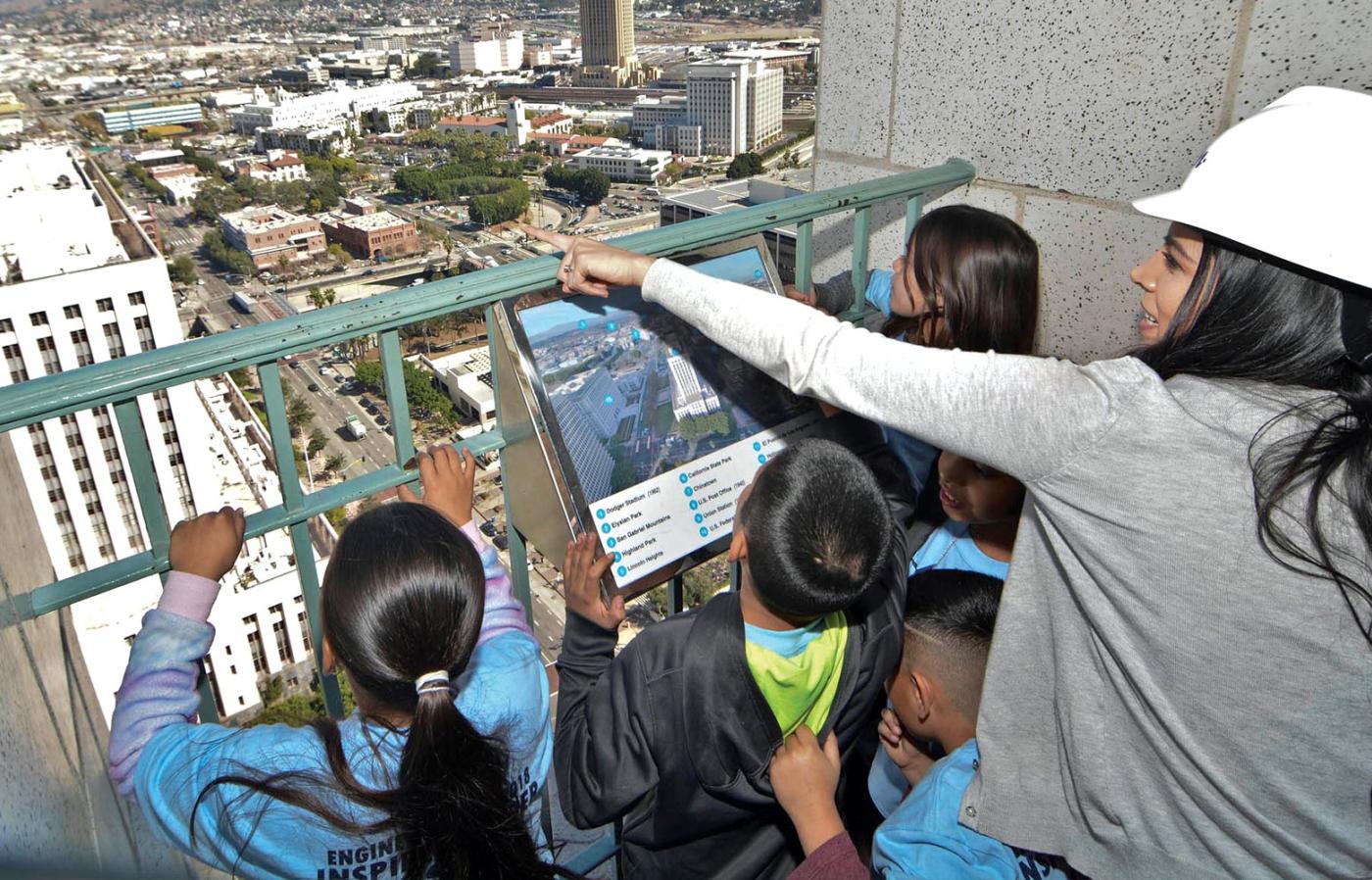 Monica Morales teaching young students about civil engineering during a field drip.