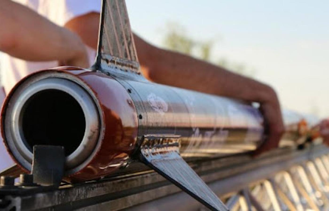 Student setting up a rocket for flight.