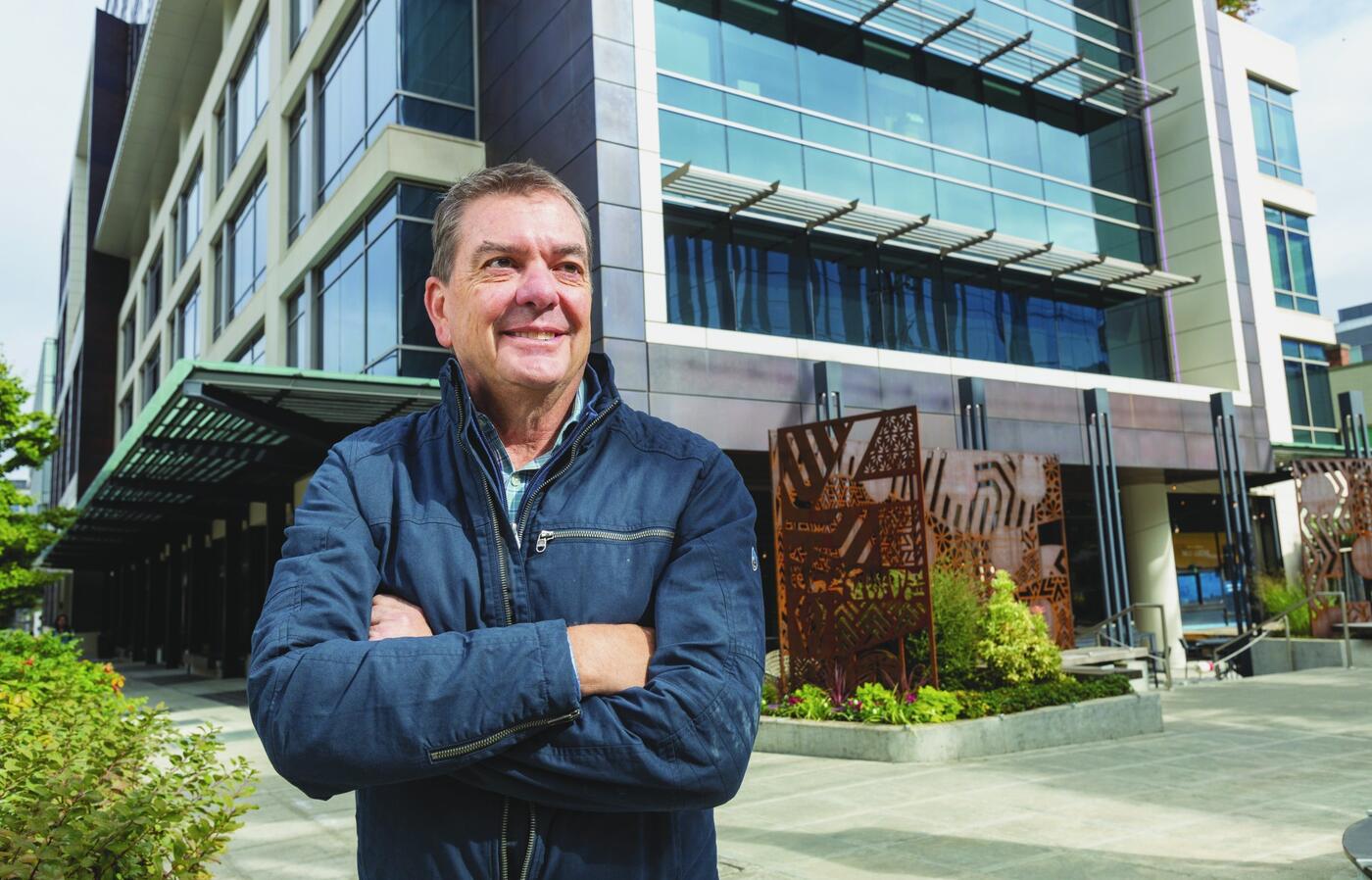 Portrait of Brad Bastian in front of a building