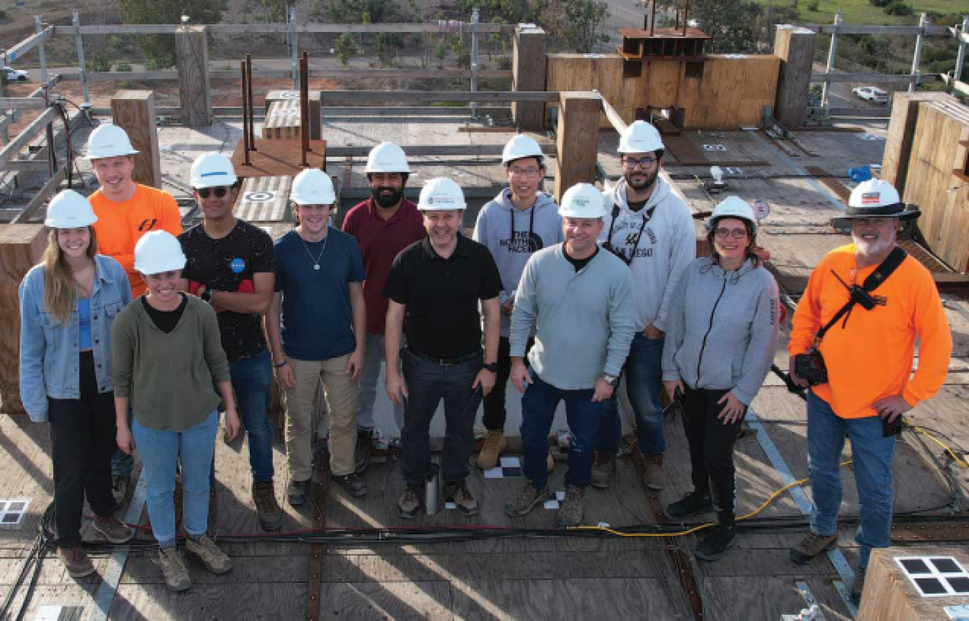 Construction workers posing as a group.