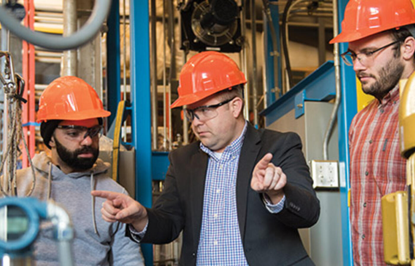 Professor Wade Marcum with graduate students Salem Sharaf and Robert Powers III.