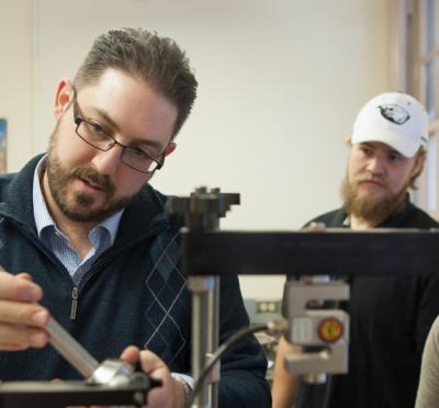 Armin Stuedlin displaying tools to students.