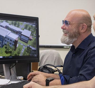 Raffaele de Amicis in his lab with graduate student Arash Shahbaz Badr.