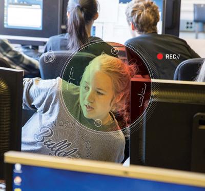 A student in front of a computer.