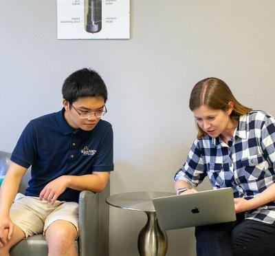 Kyzer Gerez working with Associate Professor Camille Palmer.