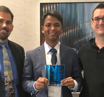 Ed Gorzkowski, Nitish Kumar and Eric Patterson posing together for a photo.