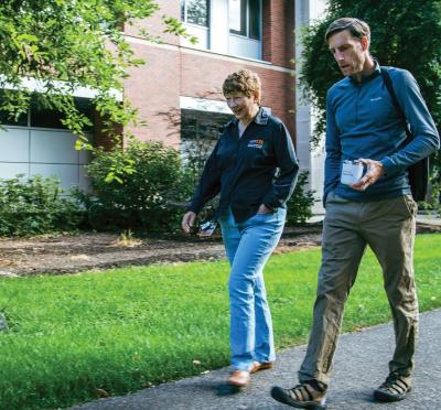 A picture of Alan Fern and Margaret Burnett walking together.