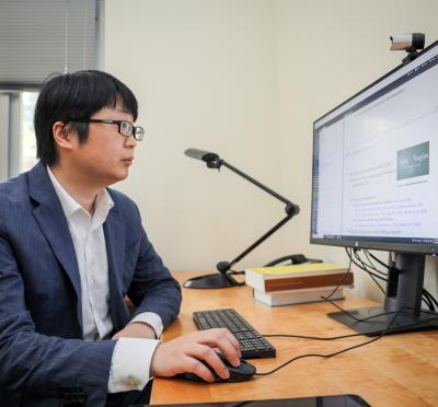 Xiao Fu in front of his computer.