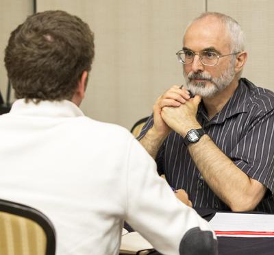Paul McKenney engaged in a conversation.
