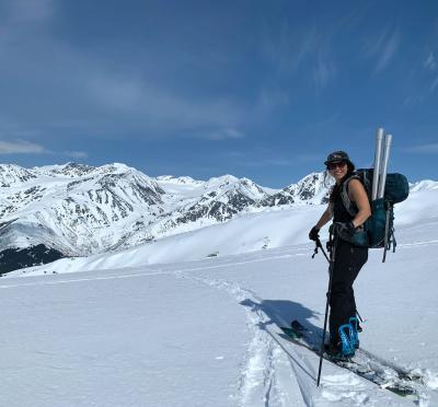 Graduate student Christina Aragon with skiis.