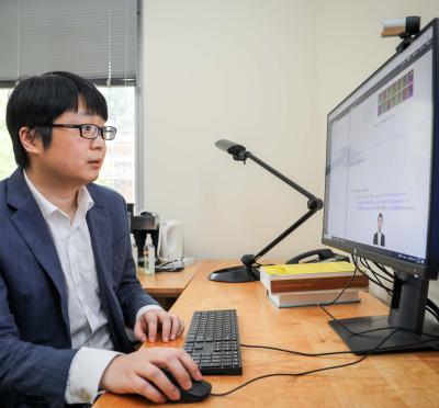 A researcher in front of a computer.