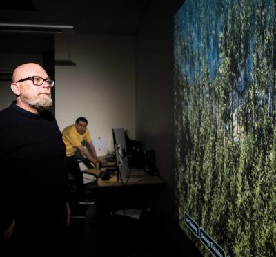 Raffaele de Amicis looking at a large screen