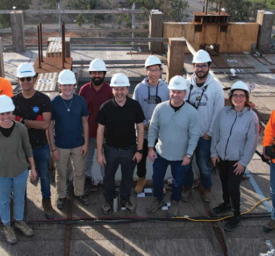 Construction workers posing as a group.