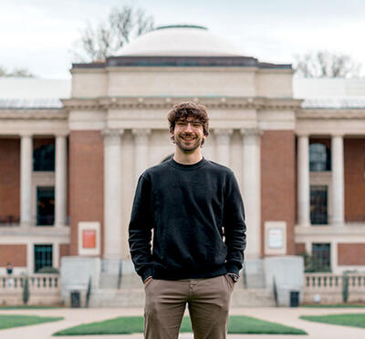 Noah Pragin poses in front of the Memorial Union.