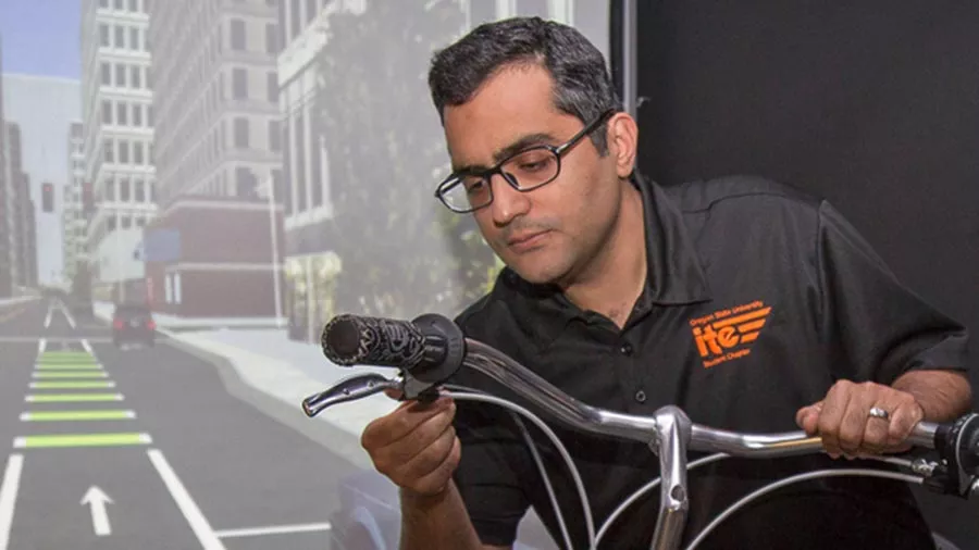 Masoud Ghodrat Abadi observing a bike handle.