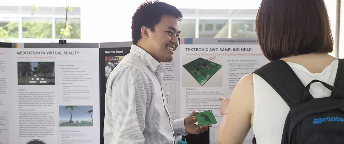 Student explains his senior design project at Expo