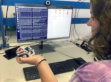 User interacting with a Cozmo robot in a break-taking intervention.