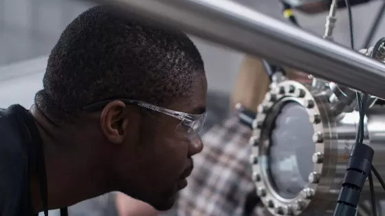 Kingsley Chukwu looking at machinery